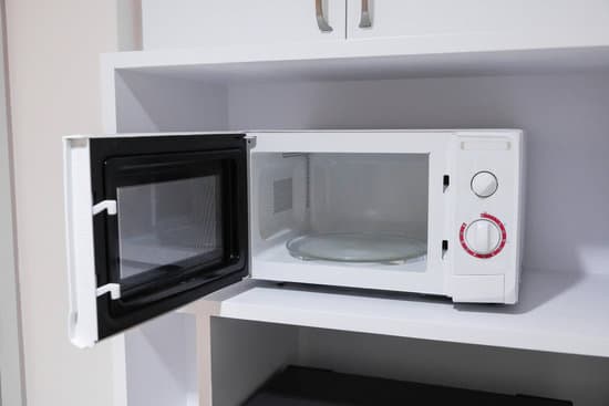 canva microwave oven in a cupboard