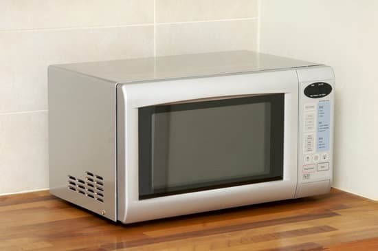 canva microwave oven on kitchen worktop MAEJQacEikI