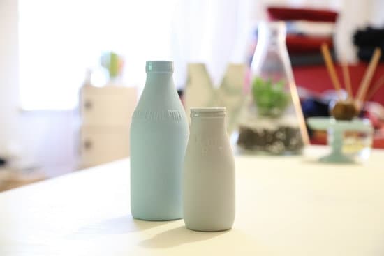 canva milk bottles on the table MADQ5hpAUQ8