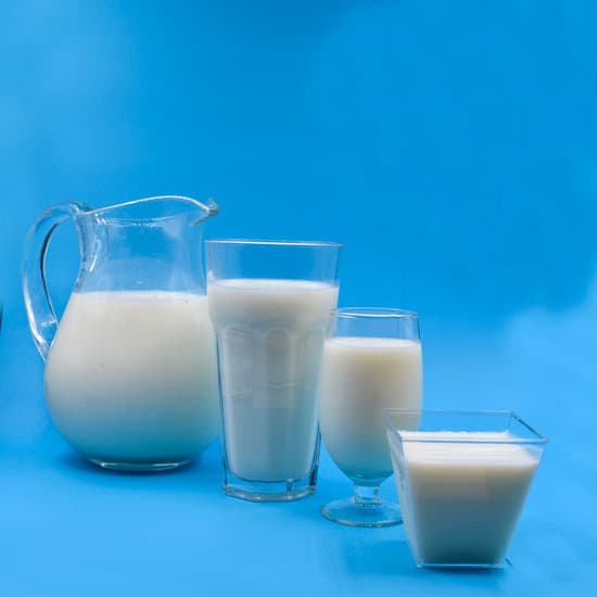 canva milk in clear glass pitcher beside drinking glass with milk MAEOYdXFpqU