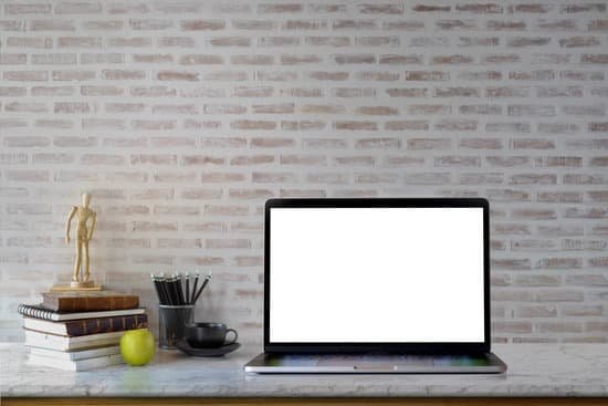 canva mock up laptop workspace with blank screen laptop on marble desk. MADat1QDVRA