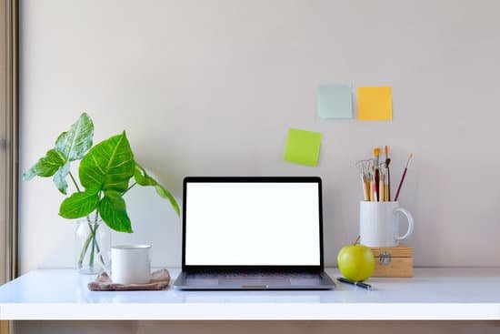 canva mockup laptop and office accessories on white desk. workspace and blank laptop MADauHNVdmE