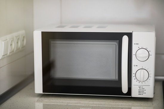 canva modern kitchen interior with electric and microwave oven. MADIobYiVXE