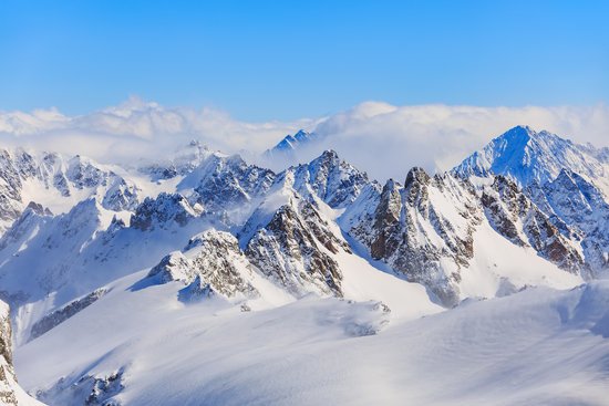 canva mountain ranges covered in snow MADGyKBOSYo