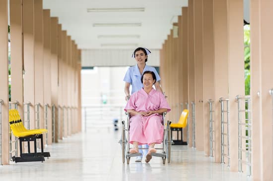 canva nurse caring for patient in a wheelchair MADQ4wgczgI