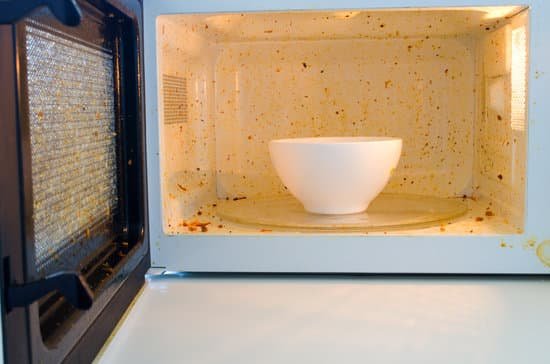 canva open microwave. dirt from food inside. close up MADerJJ5Lvo