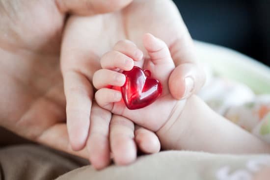 canva parents and babys hands MADaqU5HdGI