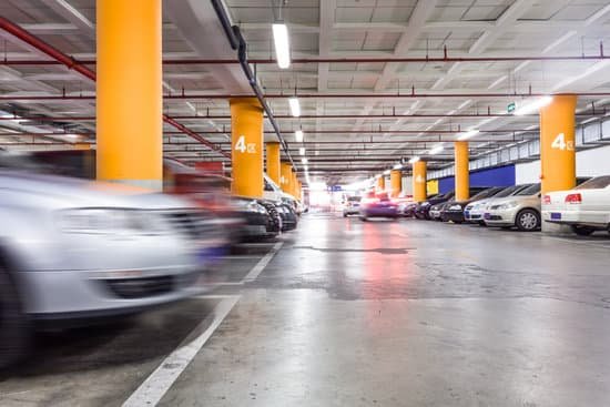 canva parking garage underground interior with a few parked cars MADarPwbZIM