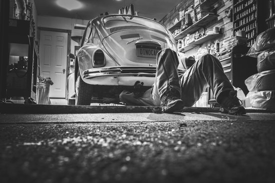 canva person fixing car