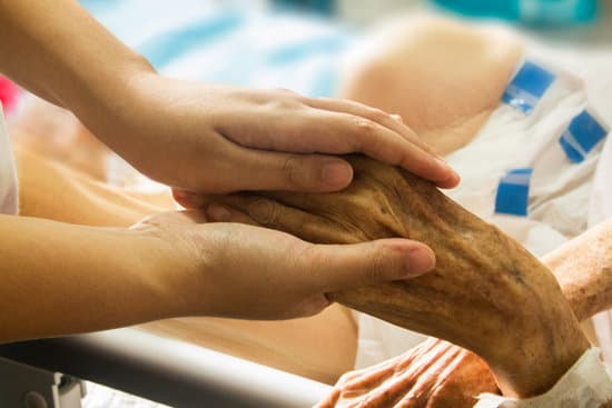 canva person holding the hand of a hospice patient MADQ42 Ylrg