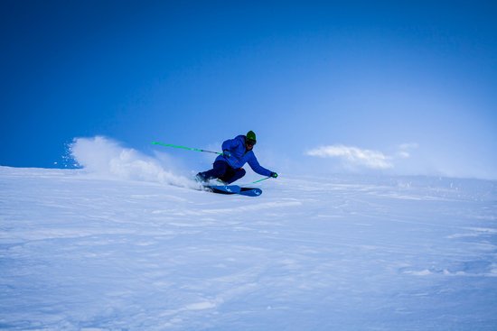 canva person riding ice skates on mountain slope