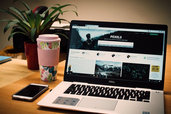 canva photo of a gray dell laptop displaying pexels webpage MADGyXZBs0w