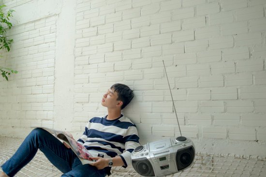 canva photo of man sitting near radio MADGvgJRuuk