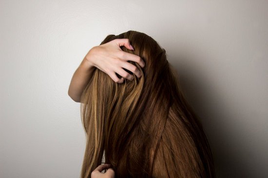 canva photo of woman covering face with her hair. MADGv4LHy A