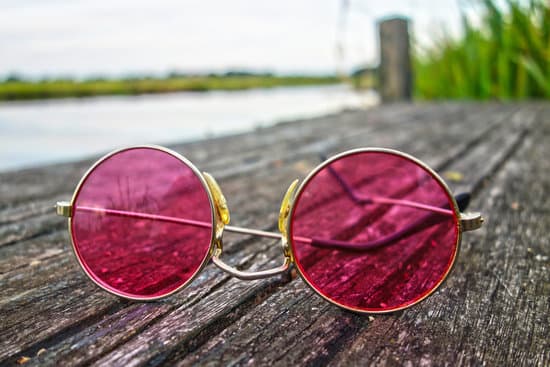 canva pink sunglasses on wooden floor MADQ5O r0EQ