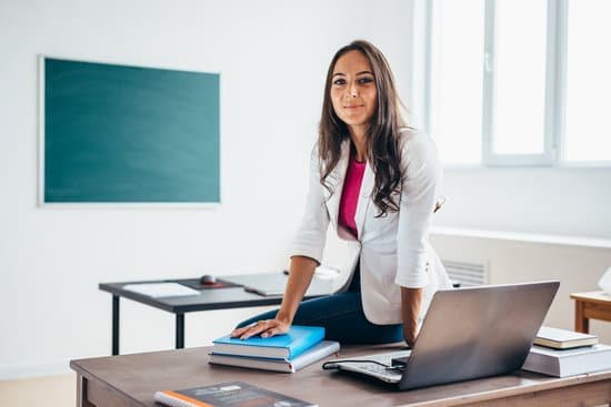 canva portrait of female college teacher smiling at camera MADZ 4YWyZc