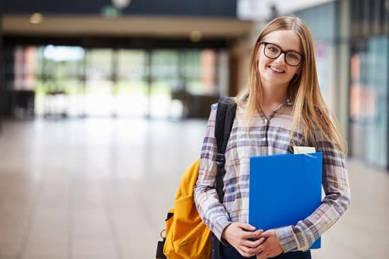 canva portrait of female student standing in college building MACowQFfpr0