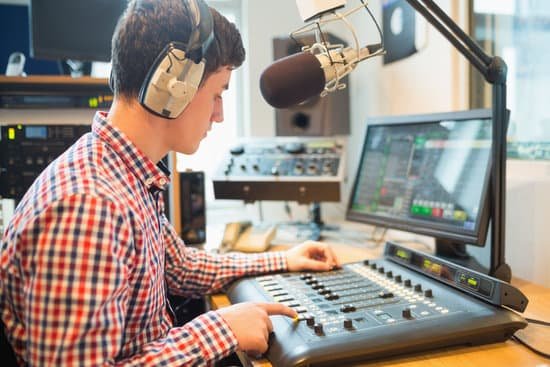 canva radio host using sound mixer in studio