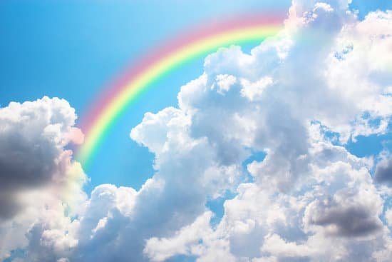 canva rainbow in blue sky. MADesdZ n M