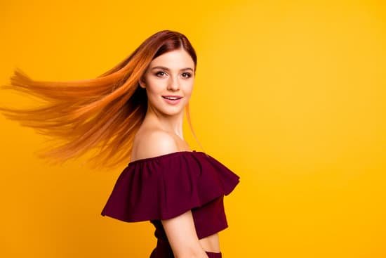 canva red straight haired attractive cute nice cheerful young girl half turned wind blowing hair. isolated over bright vivid yellow background MADapYUJ7ag