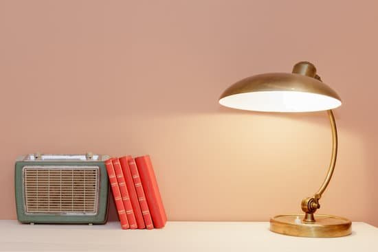 canva retro style table with lamp books and radio