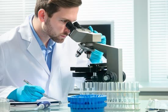canva scientist looking through a microscope