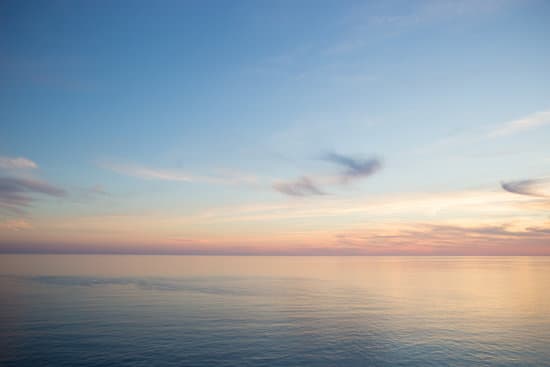canva sea against the blue sky at sunset background MAEQYoKCbSo
