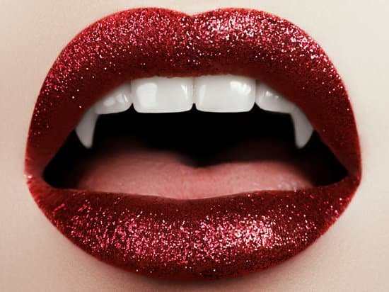 canva sexy woman lips with bloody lipstick. fashion glamour halloween art design. vampire girl getting ready to celebrate halloween