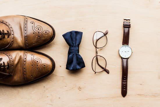 canva shoes tie bow with glasses and watch on wooden floor MADaA5otPi0