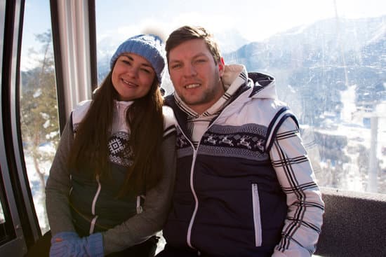 canva ski lift skiing ski resort happy skiers on ski lift. MAEN0vTAyww
