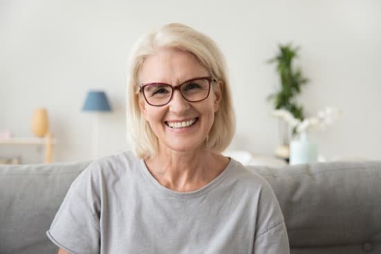 canva smiling middle aged mature grey haired woman looking at camera MADerKOuTNk