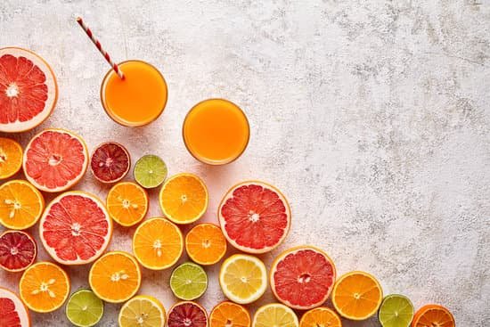 canva smoothie or fresh juice vitamin in citrus fruits background flat lay helthy beverage MADasz2 oek