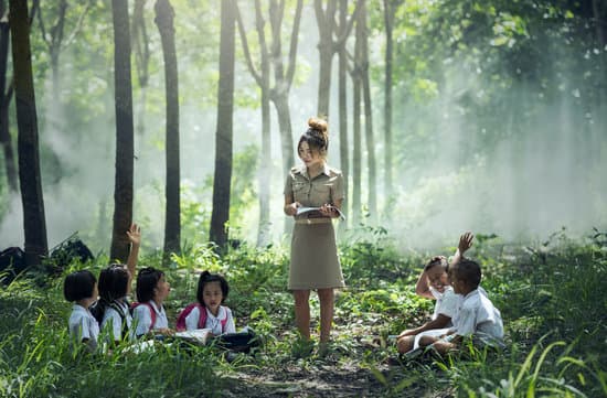 canva teacher teaching asian kids outdoors MADQ4 YByYI