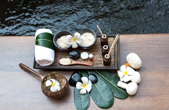 canva thai spa massage compress balls herbal ball and treatment spa relax and healthy care with flower thailand. healthy concept. select focus MADaAu04VbU