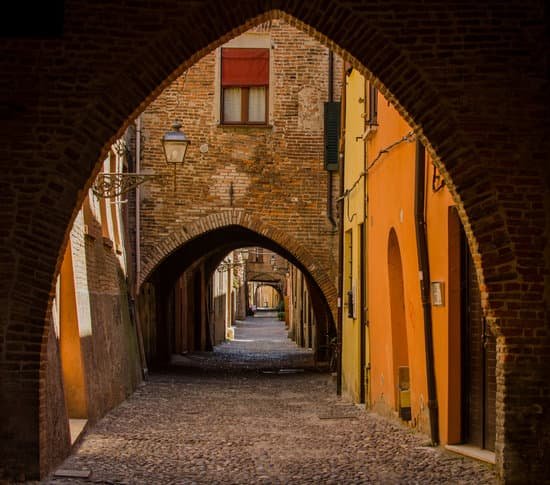 canva the picturesque medieval street via delle volte of ferrara with arches MADSRZur0Pc