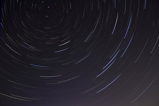 canva time lapse photo of stars on night MADGydQTups