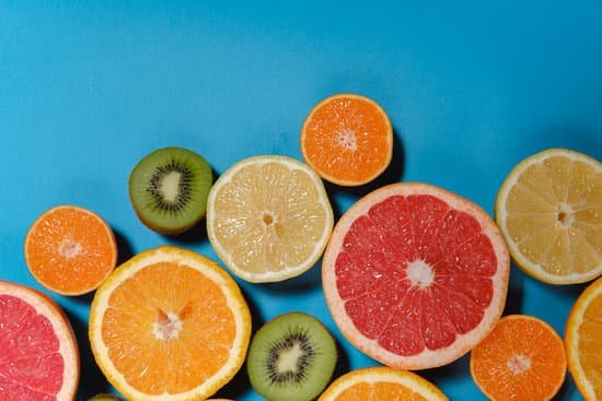 canva tropical summer mix grapefruit orange mandarin kiwi lemon. citrus fruits vegan vitamin mix flat lay on blue background healthy vegetarian organic food antioxidant detox diet. MADnR5TWJb4