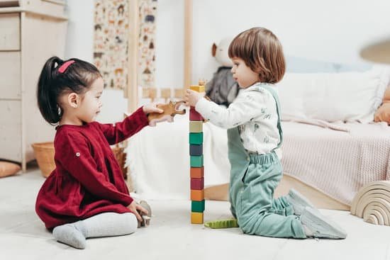 canva two children playing with lego blocks on floor MADy1jQfXOQ