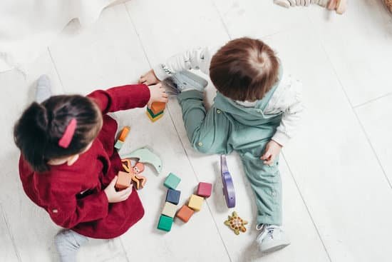 canva two children sitting down playing with lego blocks MADy1jVgCwE