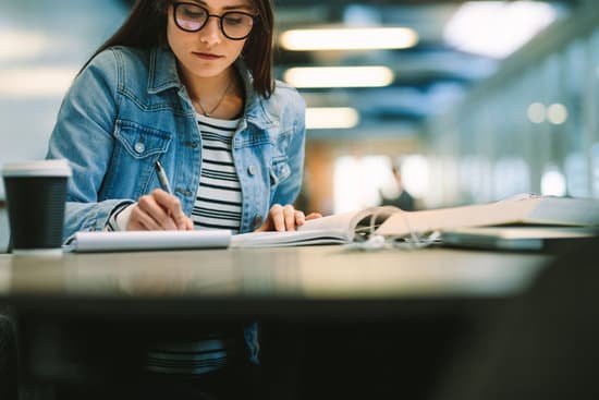 canva university student studying at college library MADQzuRVQaI