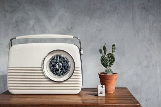 canva vintage radio with cactus on the wooden table MADaFV0PtY0