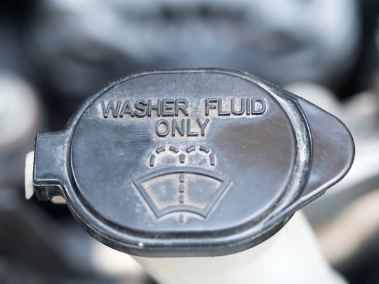 canva washer fluid. symbol of washer fluid. close up of black washer fluid inside car engine. MADFzdBPWYY