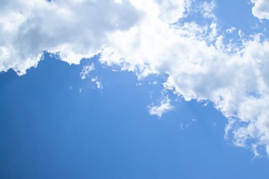 canva white fluffy clouds in a bright blue sky MAEJEQdQ7HA