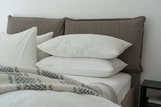 canva white pillows on a bed MADzDK WFkI