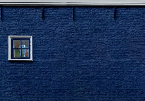 canva window in a blue brick wall MADQ5MeOZdU