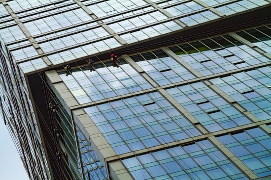 canva window washers on skyscraper.