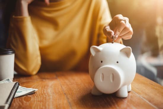 canva woman hand putting money coin into piggy for saving money wealth and financial concept.