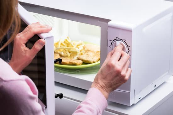 canva woman heating food in microwave