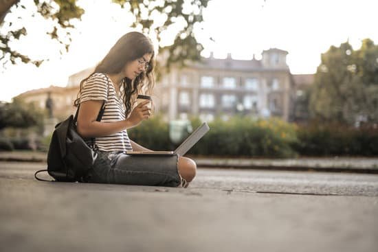canva woman in black and white stripe shirt sitting on floor while using laptop MAD29sXOllM