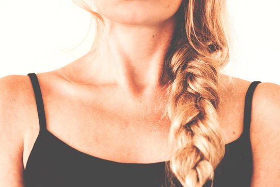 canva woman in black tank top with braided hair